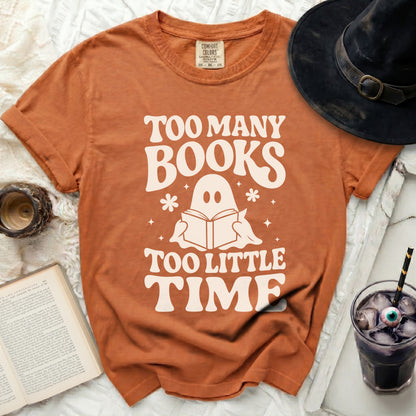 Orange t-shirt with "Too Many Books Too Little Time" and ghost design.