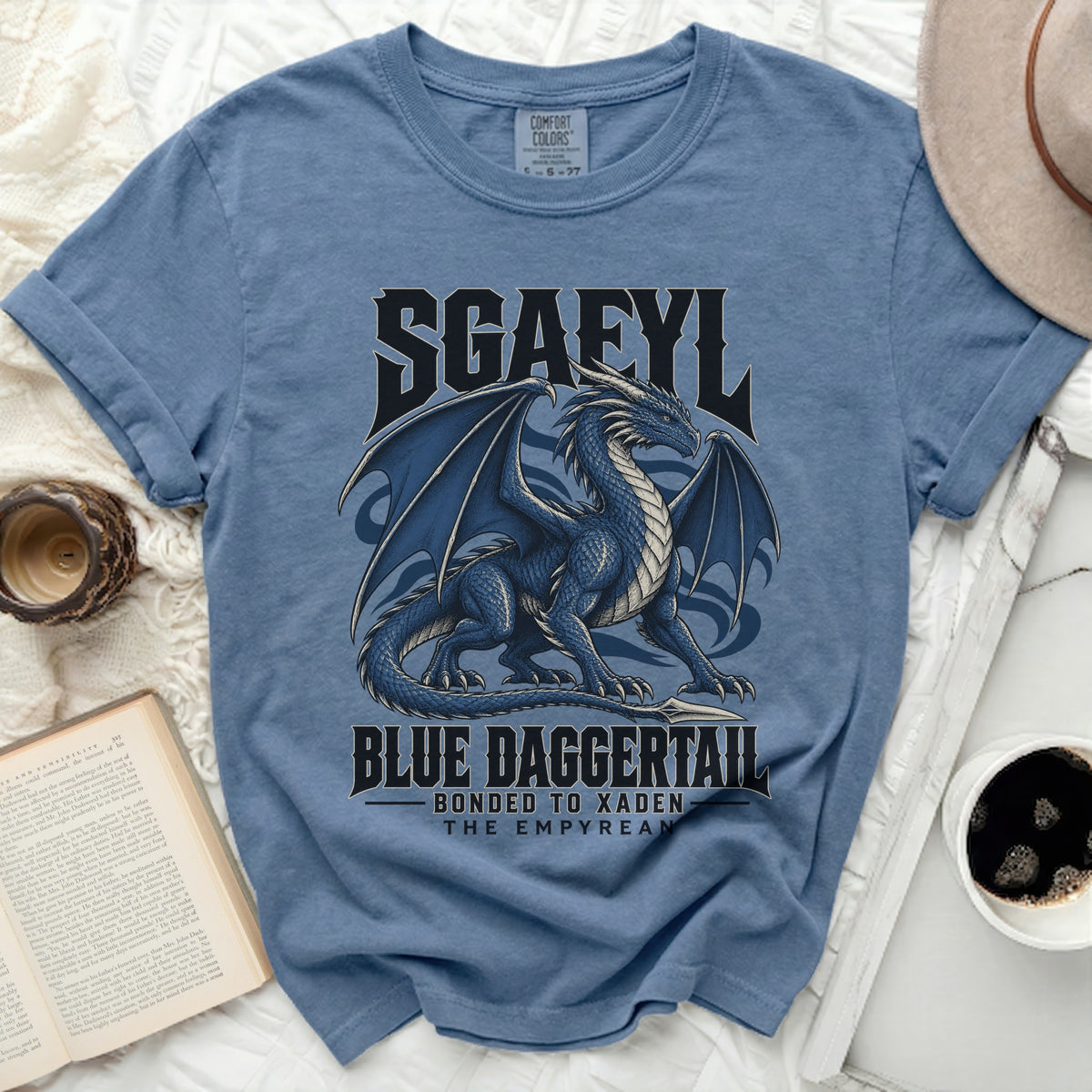 Blue t-shirt with a dragon graphic and text "SGAFYL BLUE DAGGERTAIL BONDED TO XADEN THE EMPYREAN".