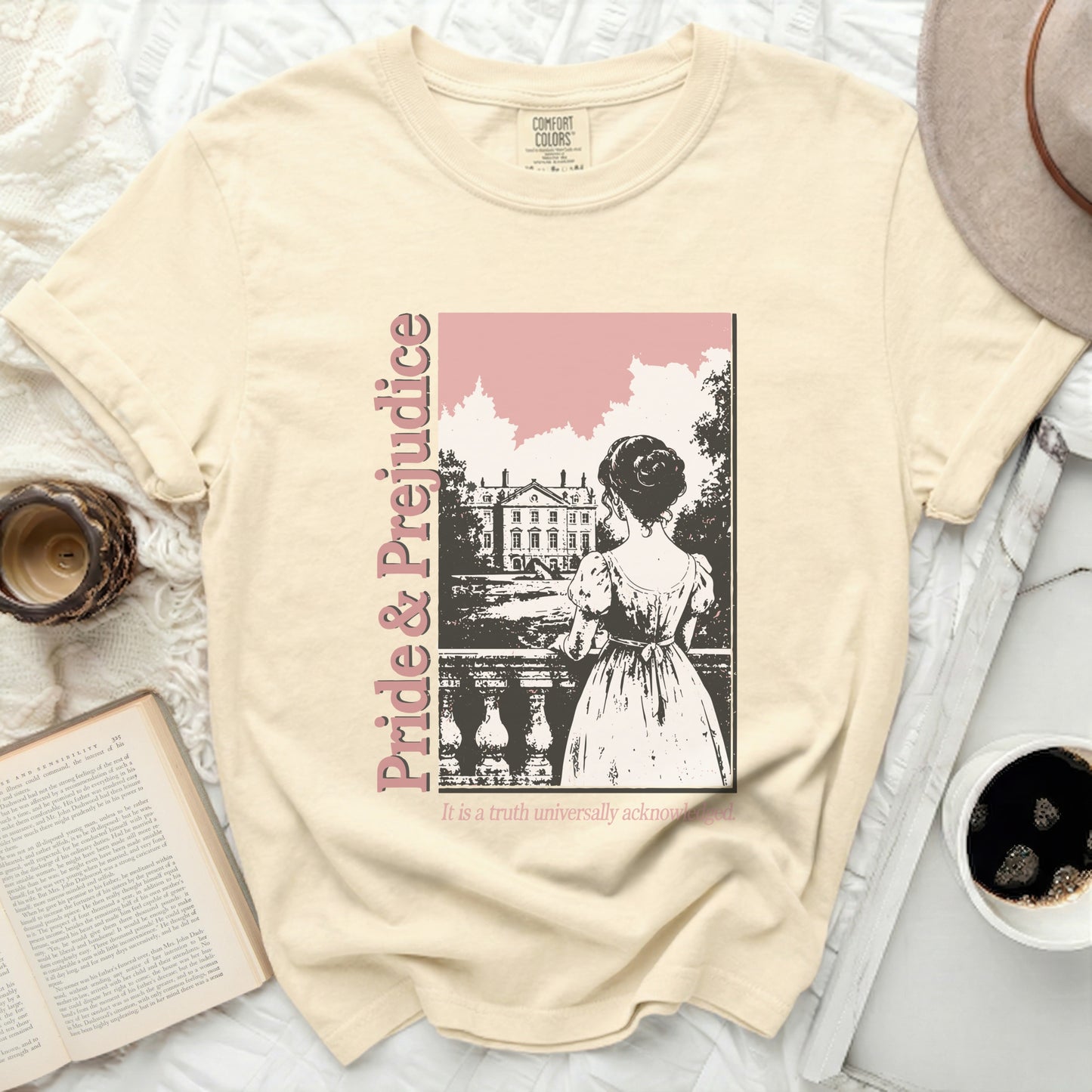 Pride & Prejudice graphic on a cream short-sleeved t-shirt