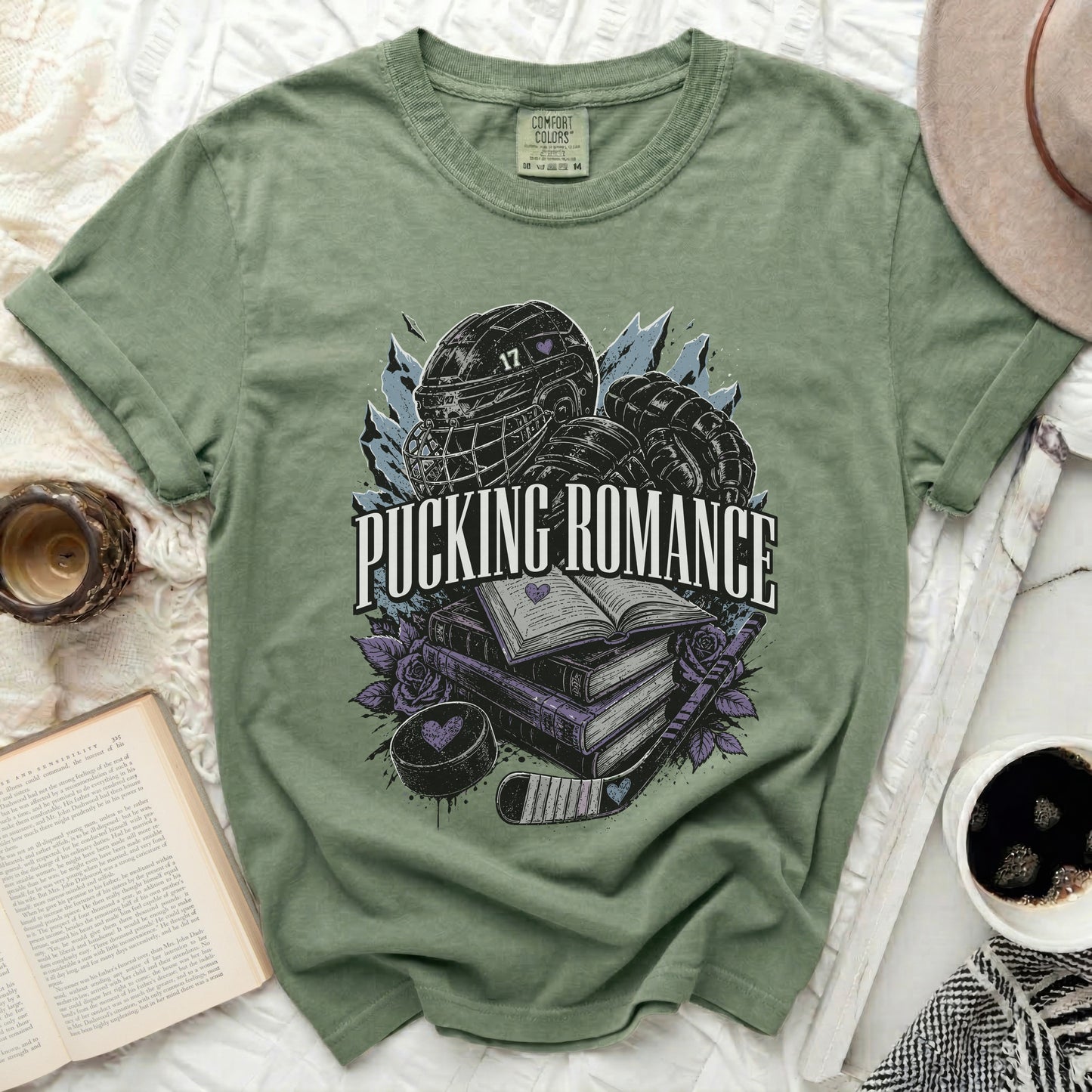 Green t-shirt with hockey gear, books, and "Pucking Romance" text.