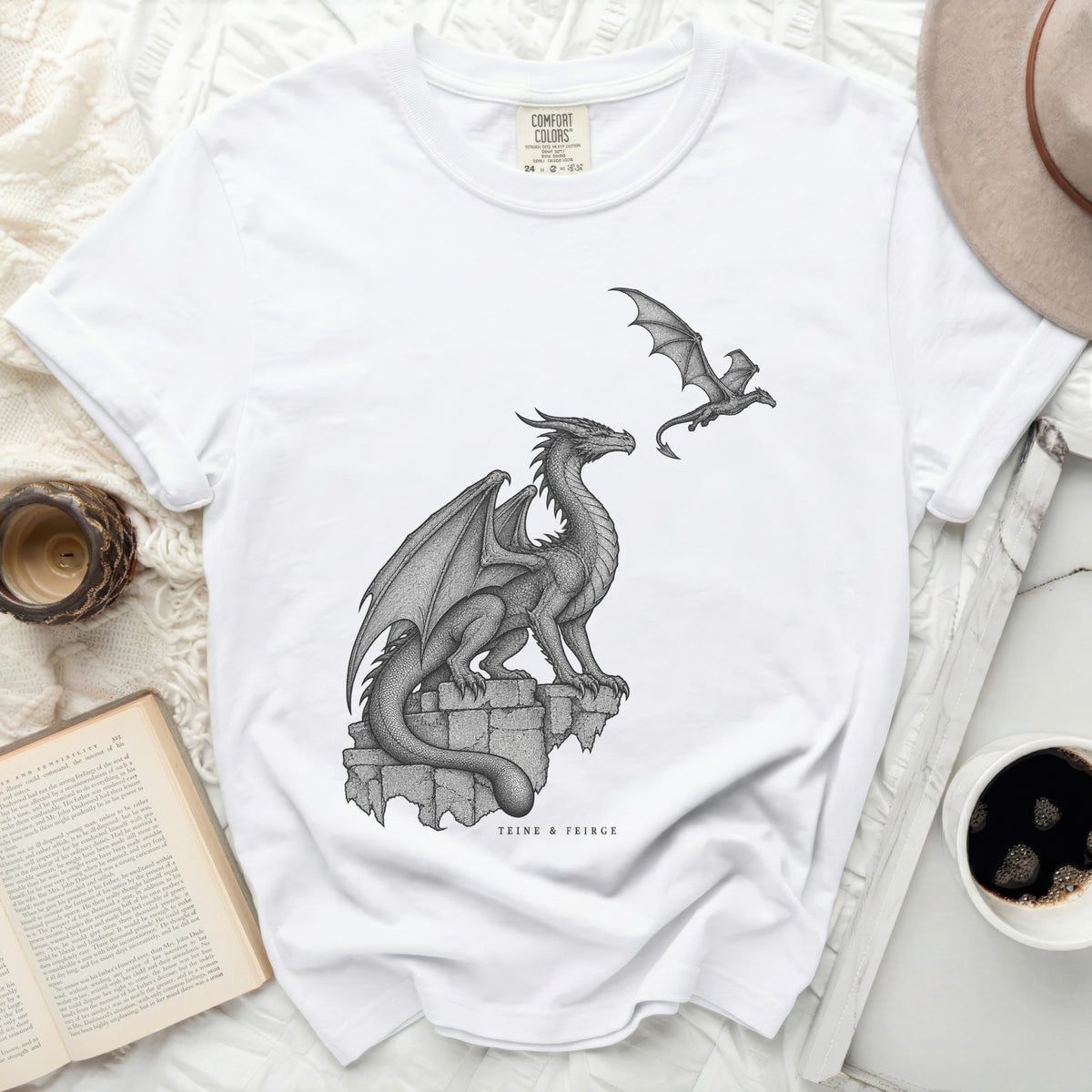 White t-shirt with dragon illustration and "TEINE & FEIRGE" text.