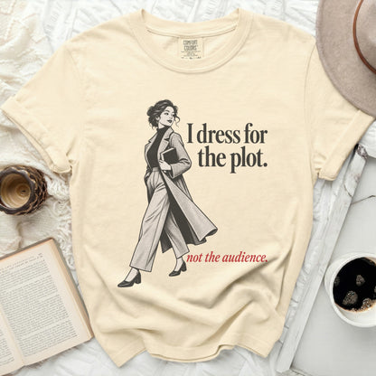 Light yellow t-shirt with "I dress for the plot. not the audience." text.
