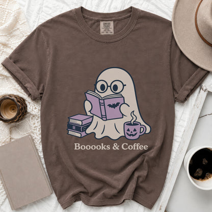 Brown t-shirt with ghost reading a book, surrounded by books and coffee.