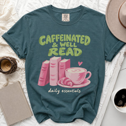 Teal t-shirt with "Caffeinated & Well Read daily essentials" text and graphic.