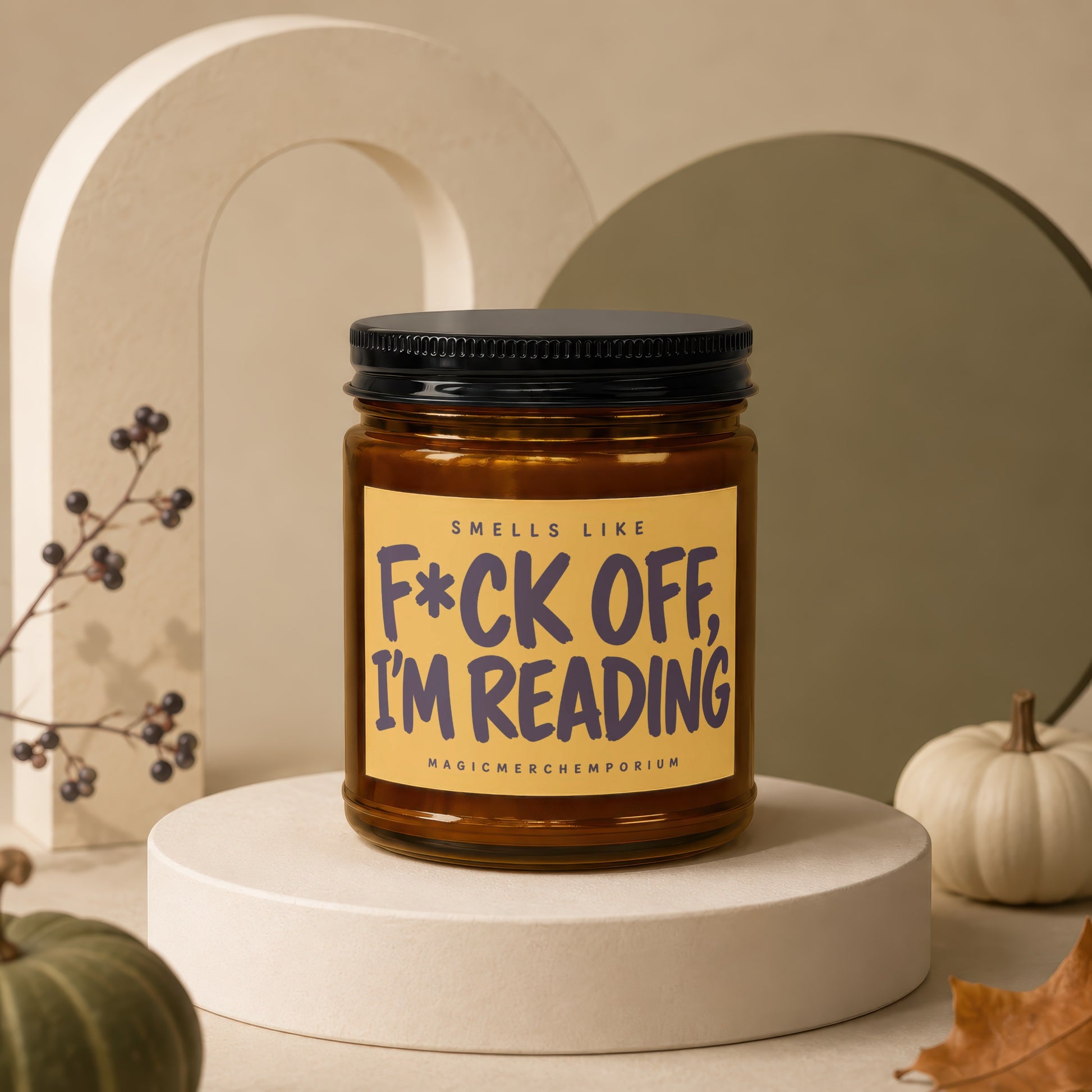 Amber jar candle with black lid, text reads "Smells Like F*ck Off, I'm Reading".