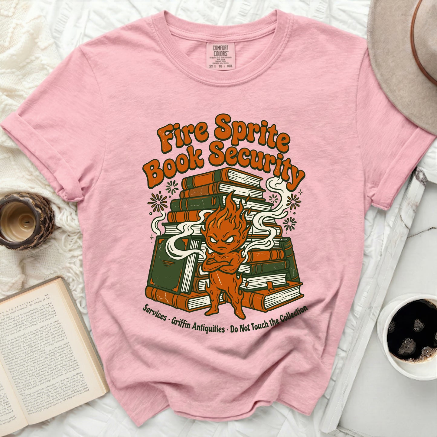 Pink t-shirt with Fire Sprite Book Security graphic and text.