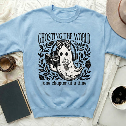 Light blue sweatshirt with a ghost reading a book and drinking coffee.