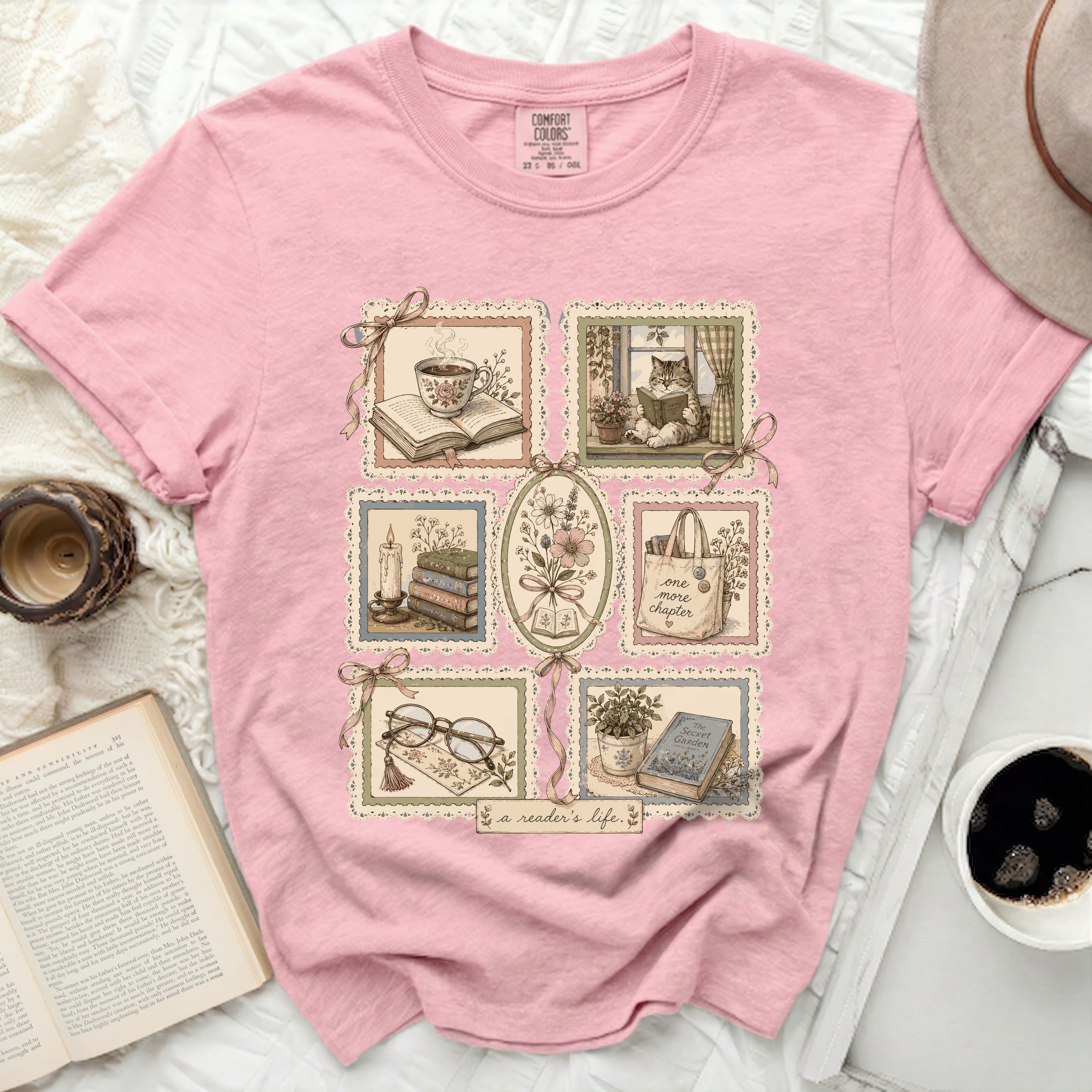 Pink t-shirt with vignettes of books, tea, and flowers and text 