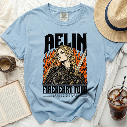 Light blue t-shirt with "AELIN FIREHEART TOUR" graphic of a woman with a sword.