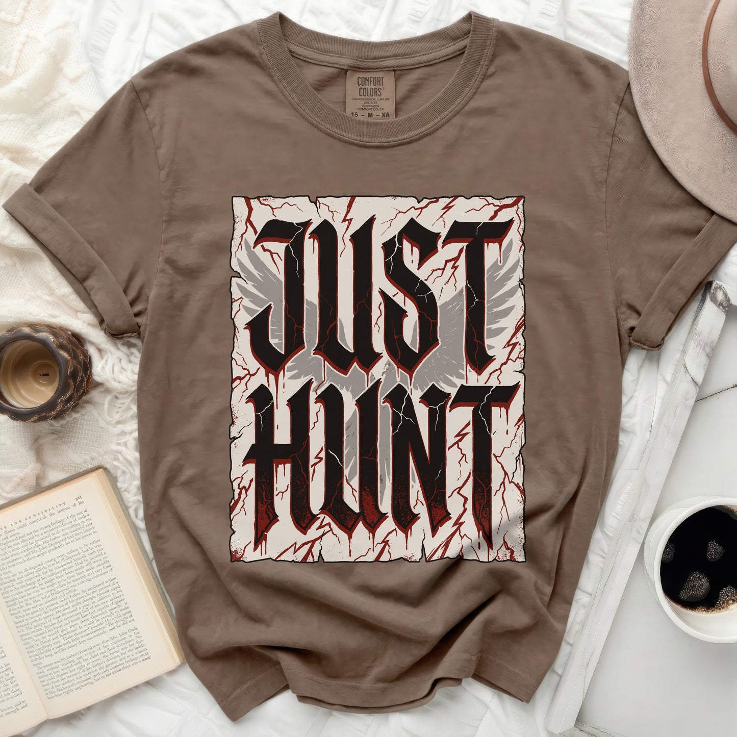 Brown t-shirt with "JUST HUNT" text in distressed gothic font and wings.