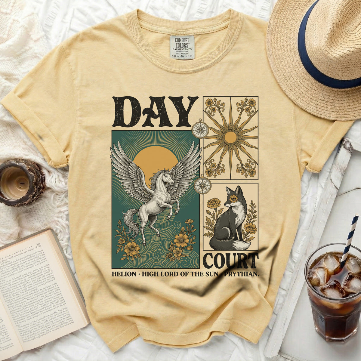Yellow t-shirt with a graphic of a winged horse, a fox, and celestial symbols.