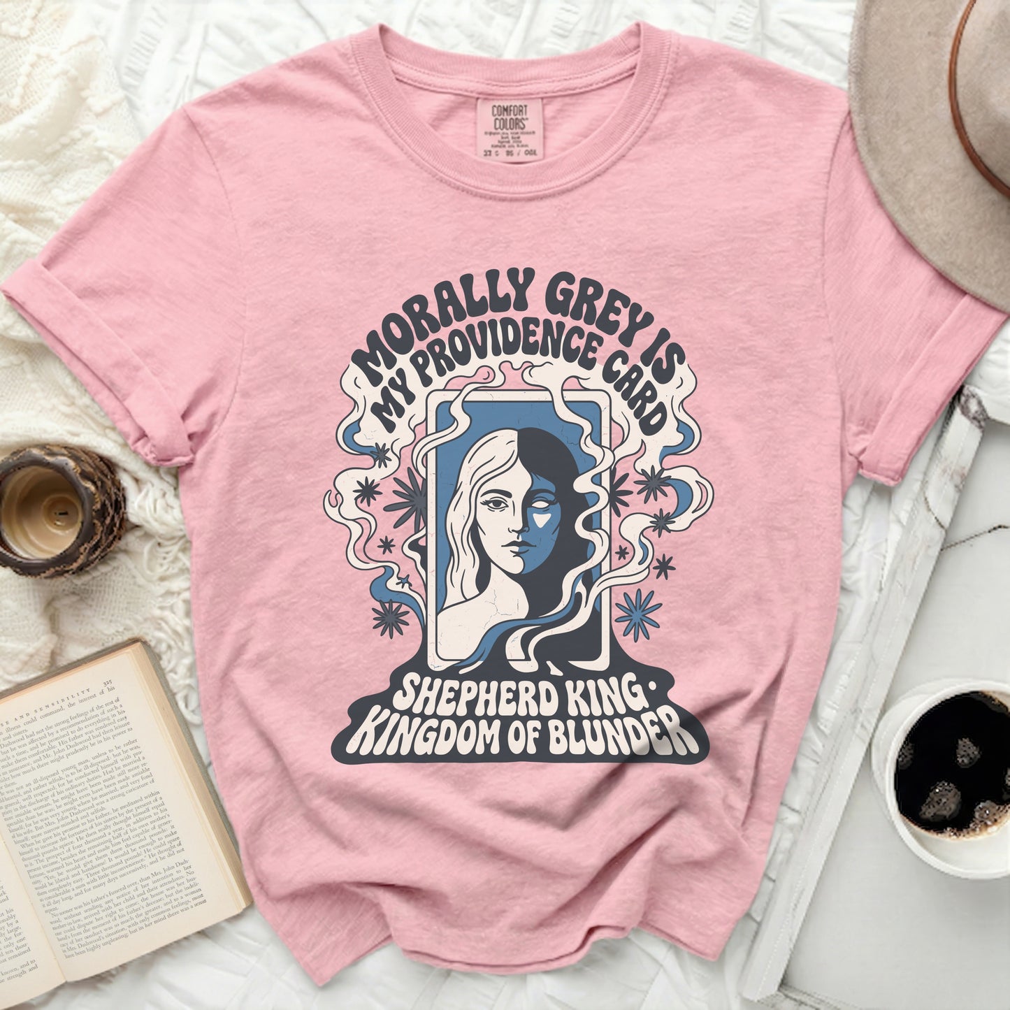 Pink t-shirt with "Morally Grey is My Providence" and graphic.