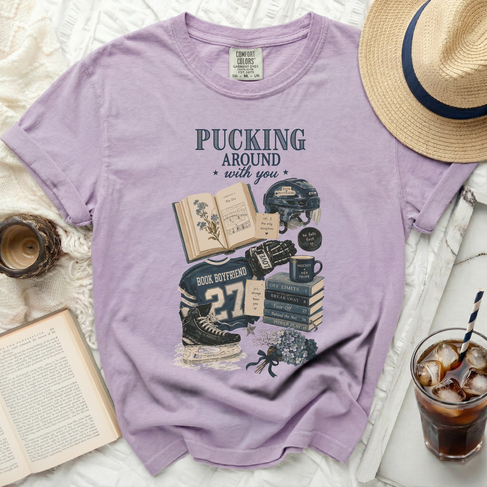 Purple t-shirt with "Pucking Around with You" hockey and book graphic.