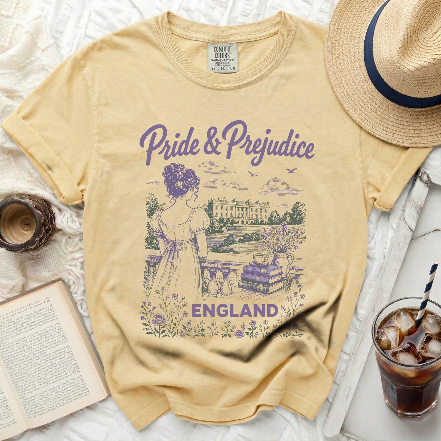 Yellow t-shirt with "Pride & Prejudice" text and illustration of a woman.