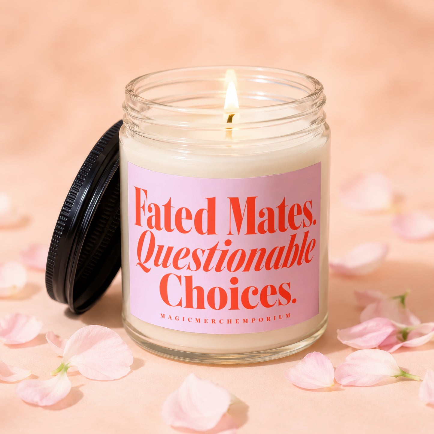 Glass candle with pink label reading "Fated Mates. Questionable Choices."