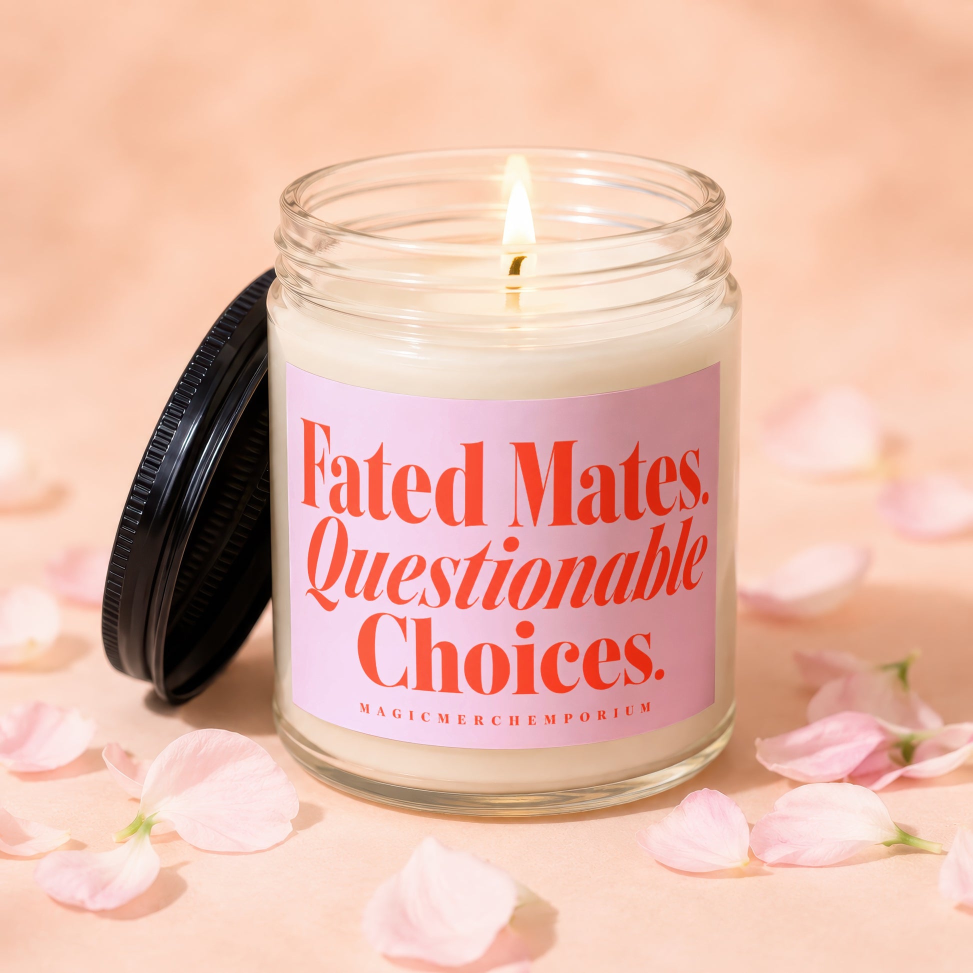 Glass candle with pink label reading "Fated Mates. Questionable Choices."