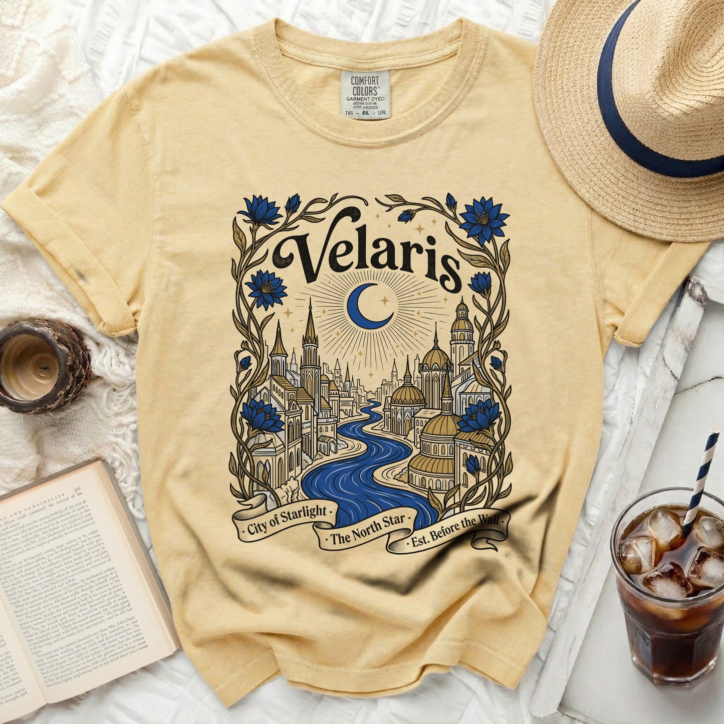 Yellow t-shirt with "Velaris City of Starlight The North Star Est. Before the Wall" graphic.
