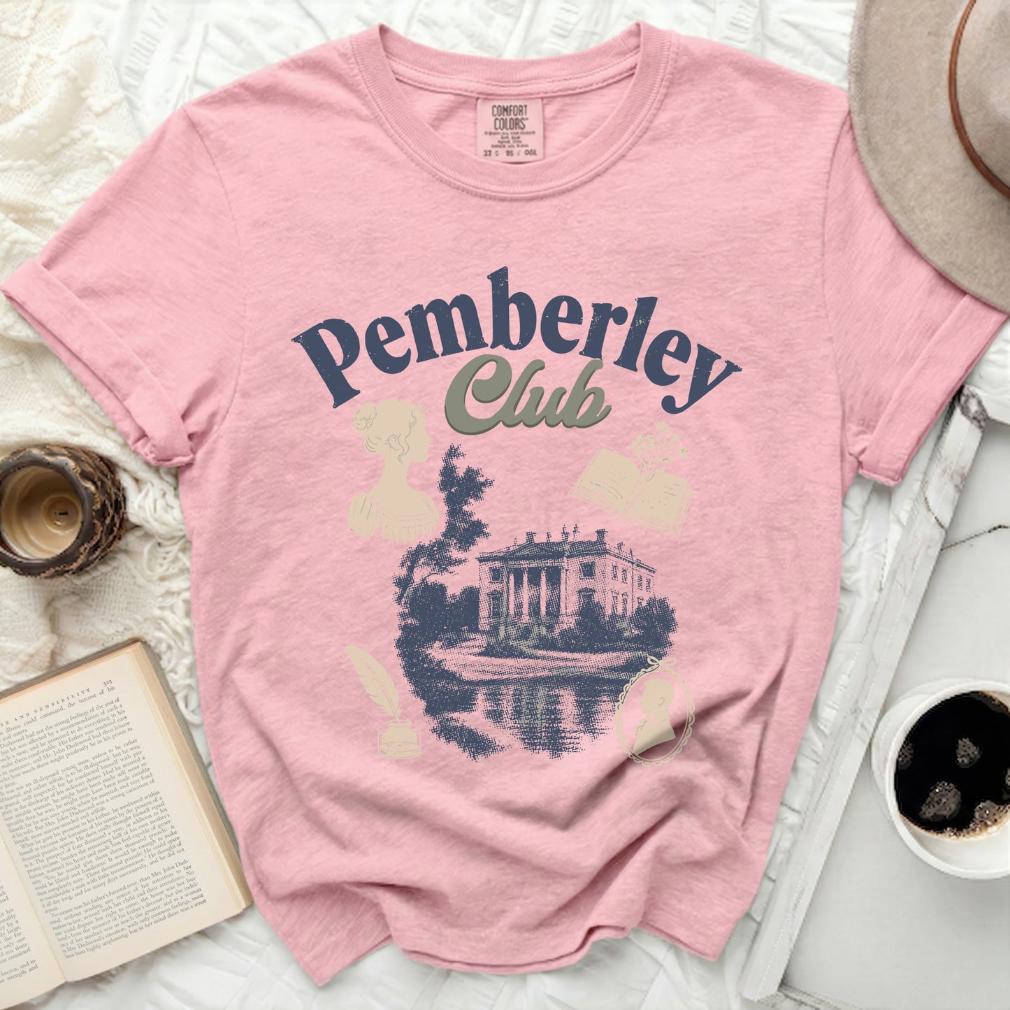 Pink Comfort Colors t-shirt with "Pemberley Club" and a manor illustration.