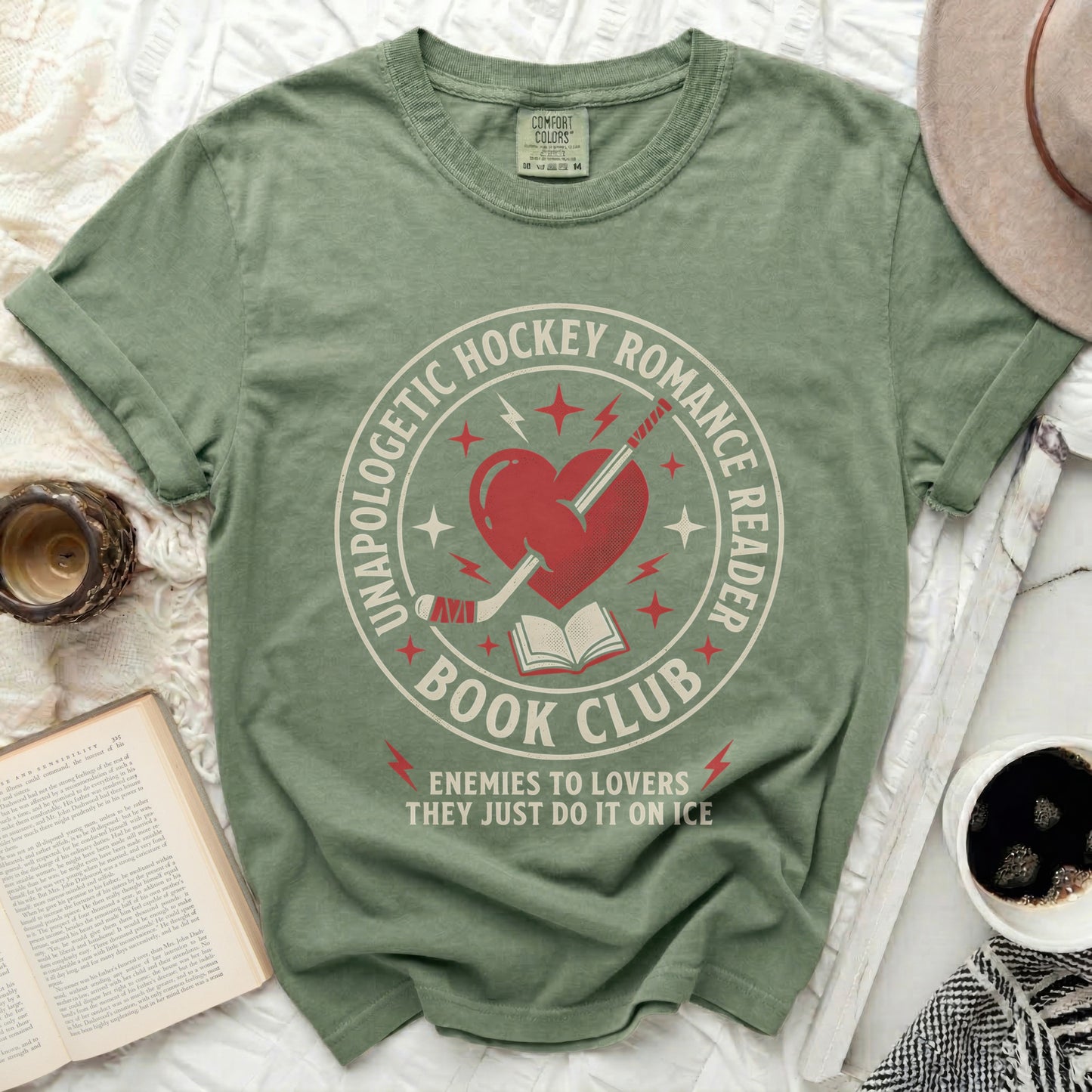 T-shirt with "Unapologetic Hockey Romance Reader Enemies to Lovers" text.