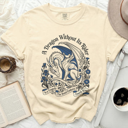 Cream t-shirt with blue dragon design and text "A Dragon Without Its Rider is a Tragedy. The Bond Endures. Fourth Wing."