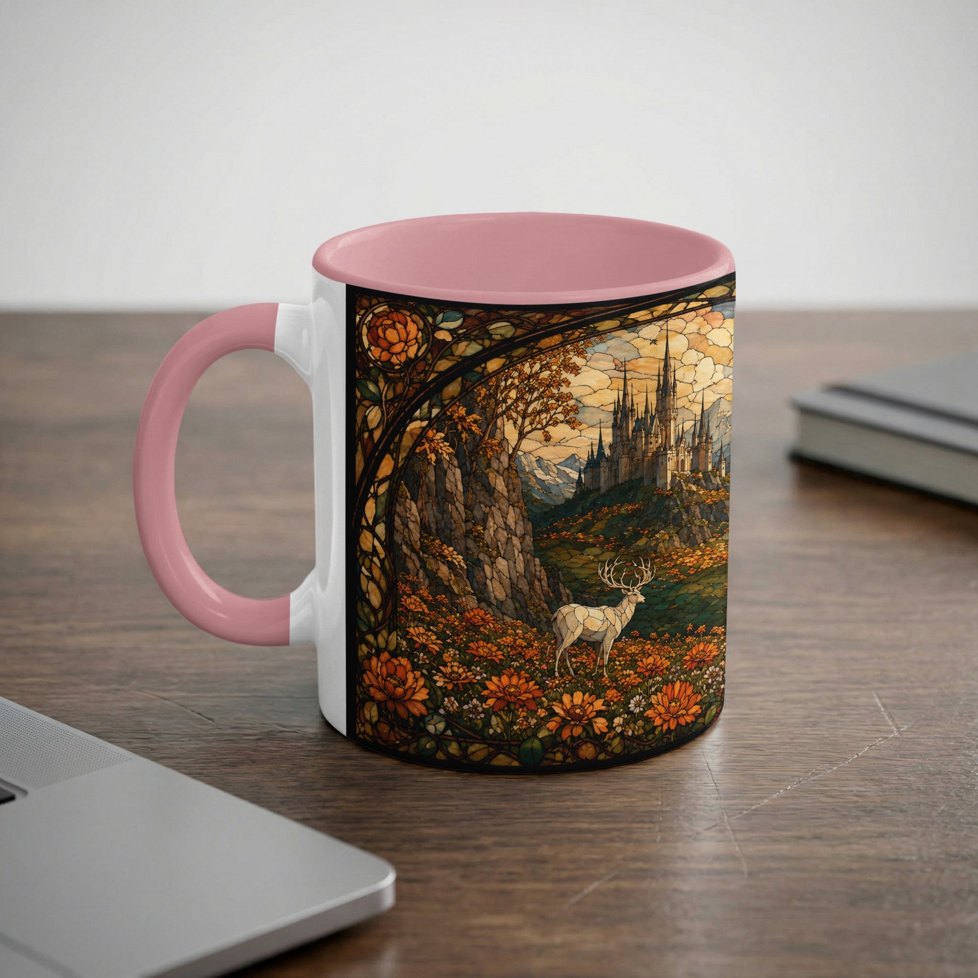 Pink and white mug with stained glass design of a castle, deer, and flowers.