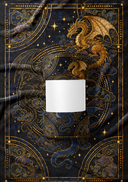Rolled blanket with golden dragons and celestial patterns on dark blue fabric.
