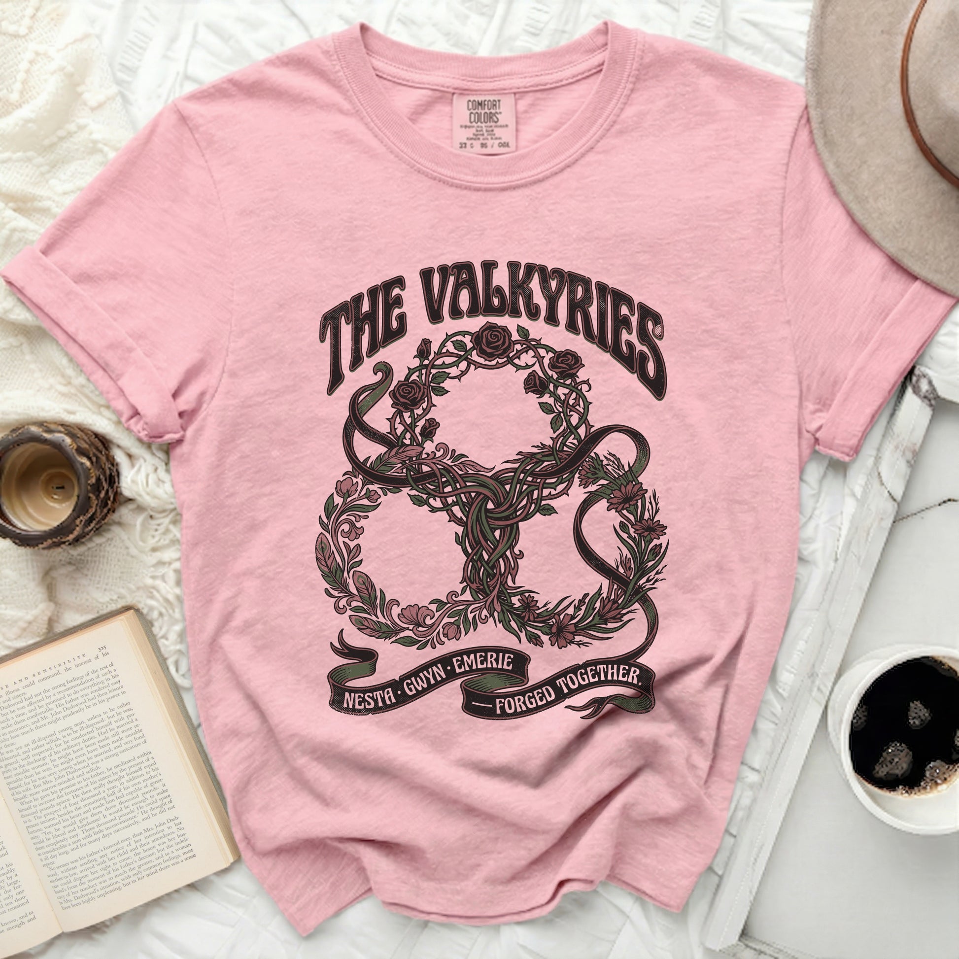 Pink t-shirt with "The Valkyries" and "Nesta, Gwyn, Emerie, Forged Together" text.
