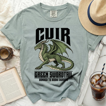 Light blue t-shirt with a green dragon graphic and "CUIR GREEN SWORDTAIL BONDED TO BODHI DURRAN" text.