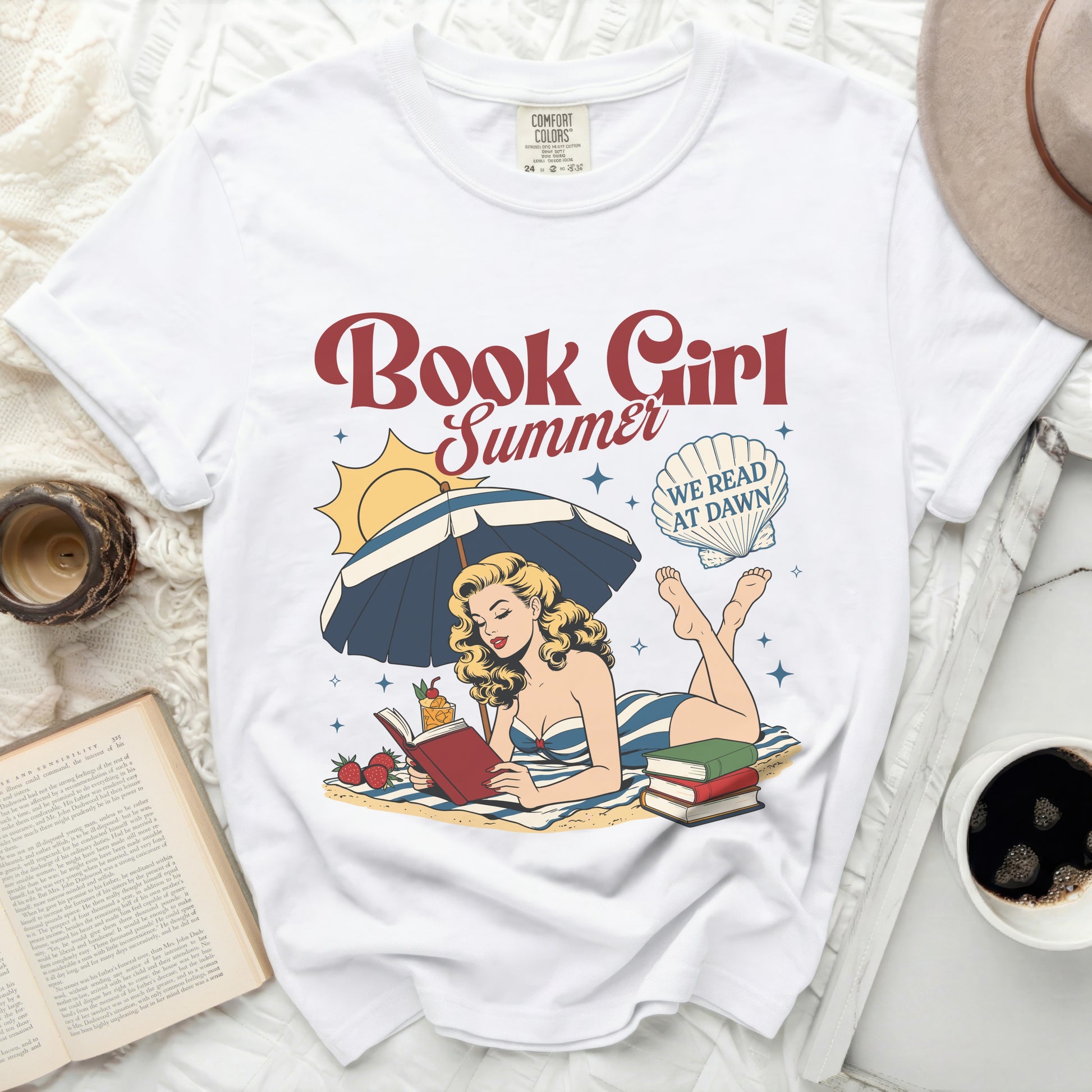 White t-shirt with "Book Girl Summer" and beach scene graphic.