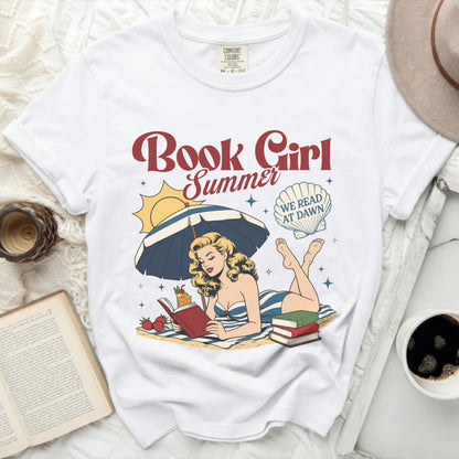 White t-shirt with "Book Girl Summer" and beach scene graphic.