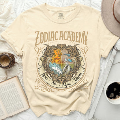Cream t-shirt with "Zodiac Academy" and four elements: fire, air, water, earth.