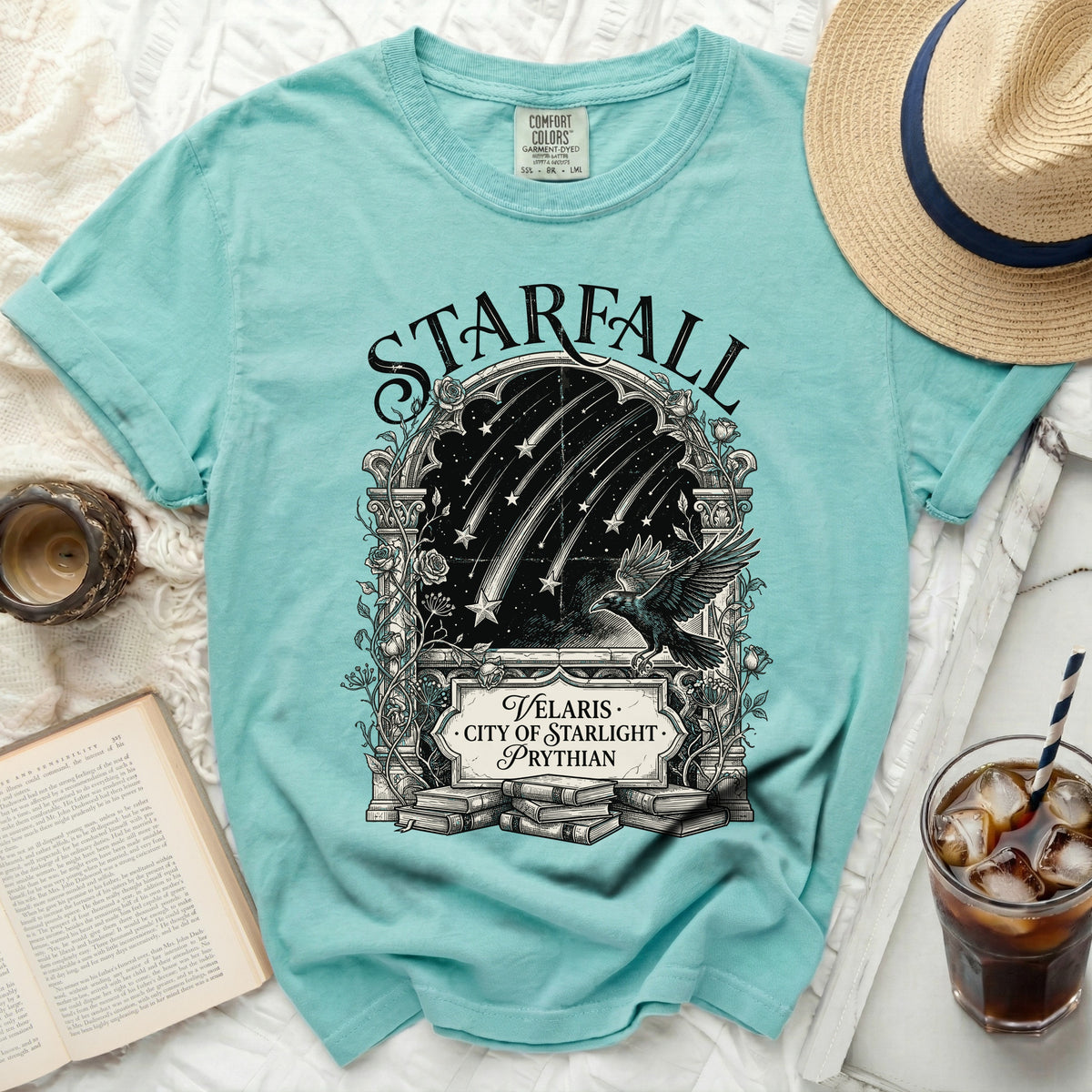 Aqua t-shirt with "Starfall," "Velaris City of Starlight Prythian," and raven illustration.
