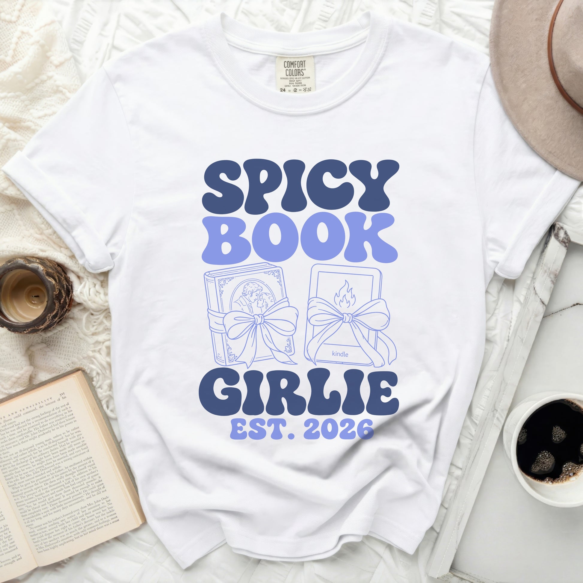 White Comfort Colors t-shirt with "SPICY BOOK GIRLIE EST. 2026" text.