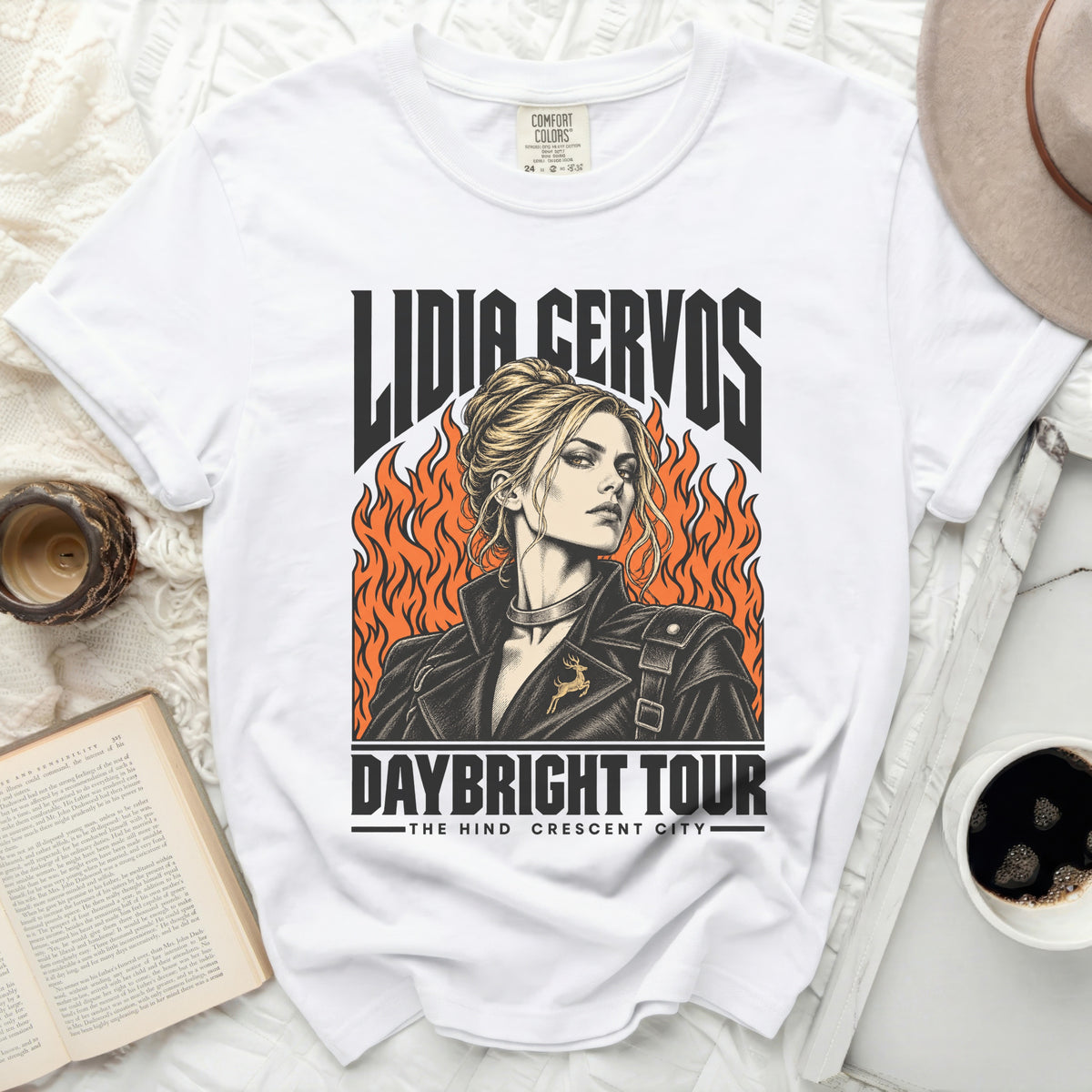 White t-shirt with Lidia Cervos graphic, flames, and "Daybright Tour The Hind Crescent City" text.