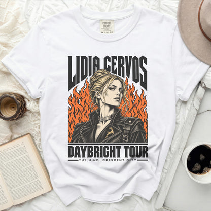 White t-shirt with Lidia Cervos graphic, flames, and "Daybright Tour The Hind Crescent City" text.