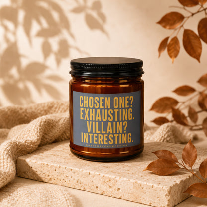 Brown glass candle with label text "Chosen One? Exhausting. Villain? Interesting."