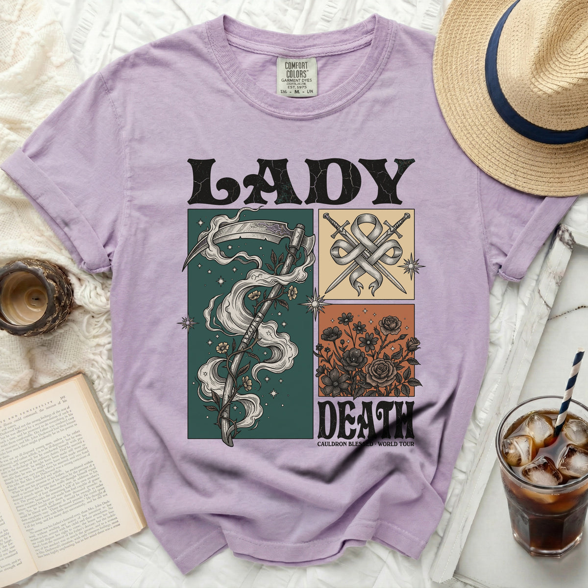 Lavender Comfort Colors t-shirt with "LADY DEATH" and grim reaper, swords, and roses graphic.