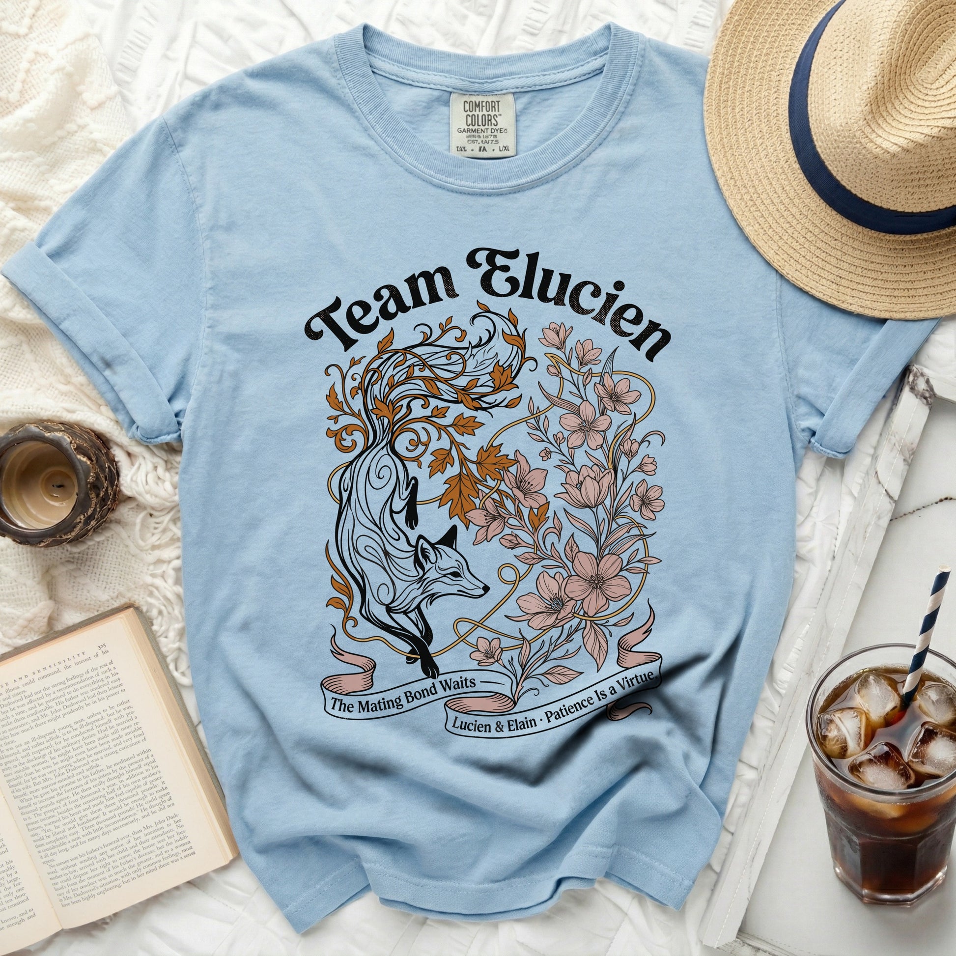 Light blue t-shirt with "Team Elucien" and fox floral design.