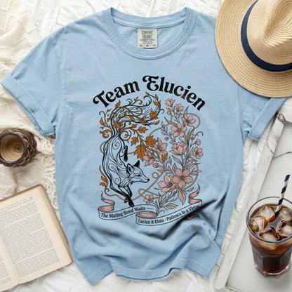 Light blue t-shirt with "Team Elucien" and fox floral design.