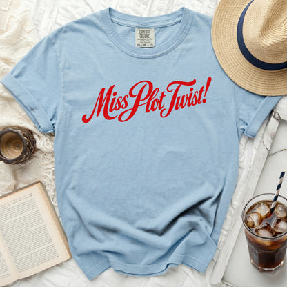 Light blue t-shirt with red "Miss Plot Twist!" graphic and Comfort Colors tag.