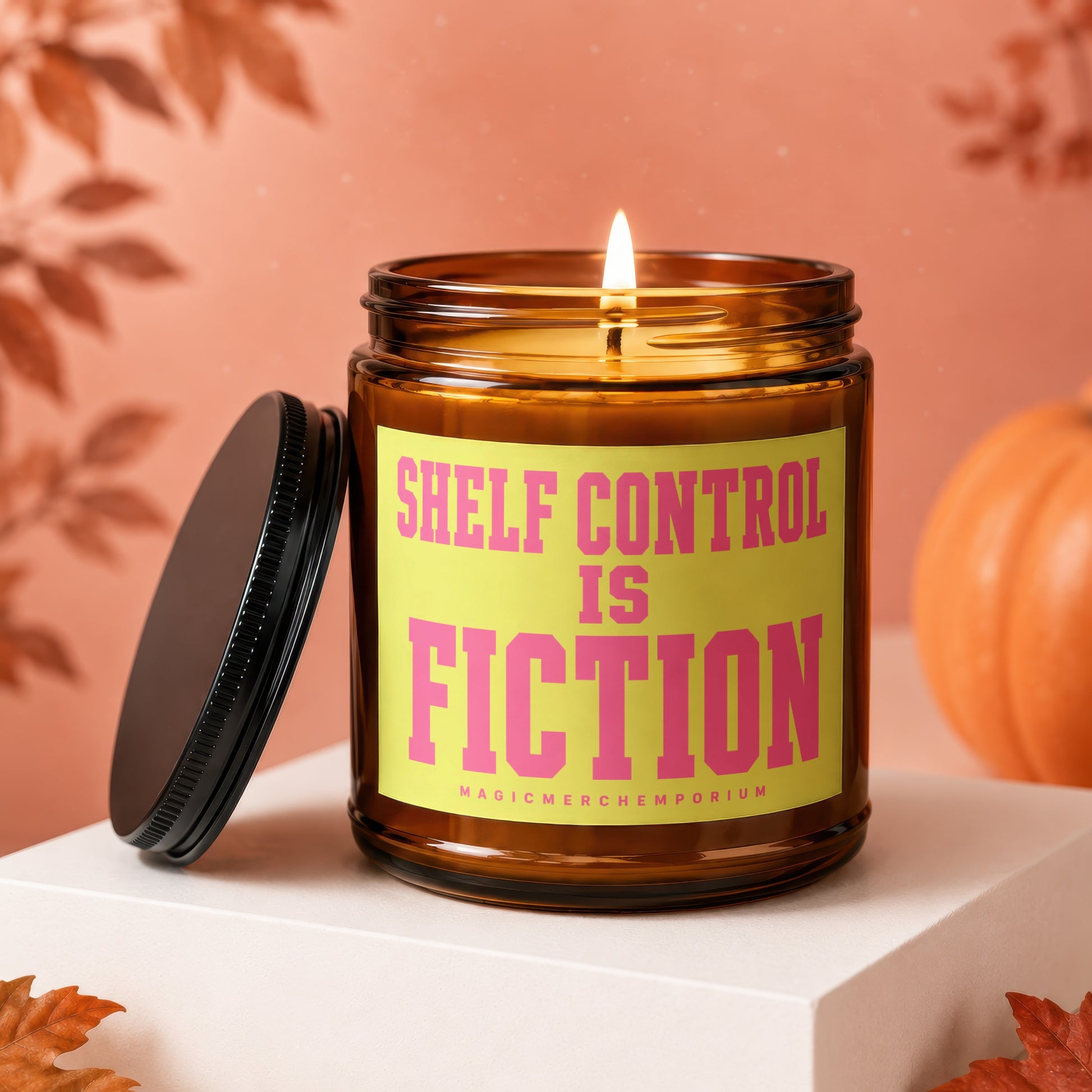 Candle with lit wick and text "Shelf Control is Fiction" on a yellow label.