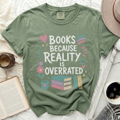 Sage green t-shirt with "Books Because Reality Is Overrated" graphic.