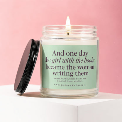 Candle with text "And one day the girl with the books became the woman writing them."