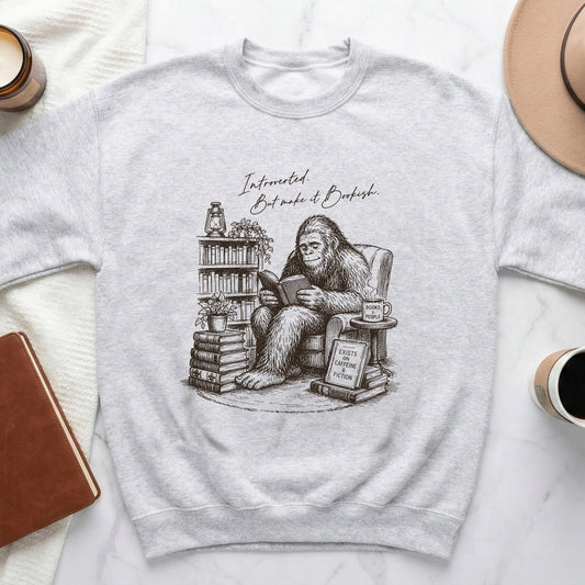 Sweatshirt with Bigfoot reading, saying "Introverted. But make it Bookish."