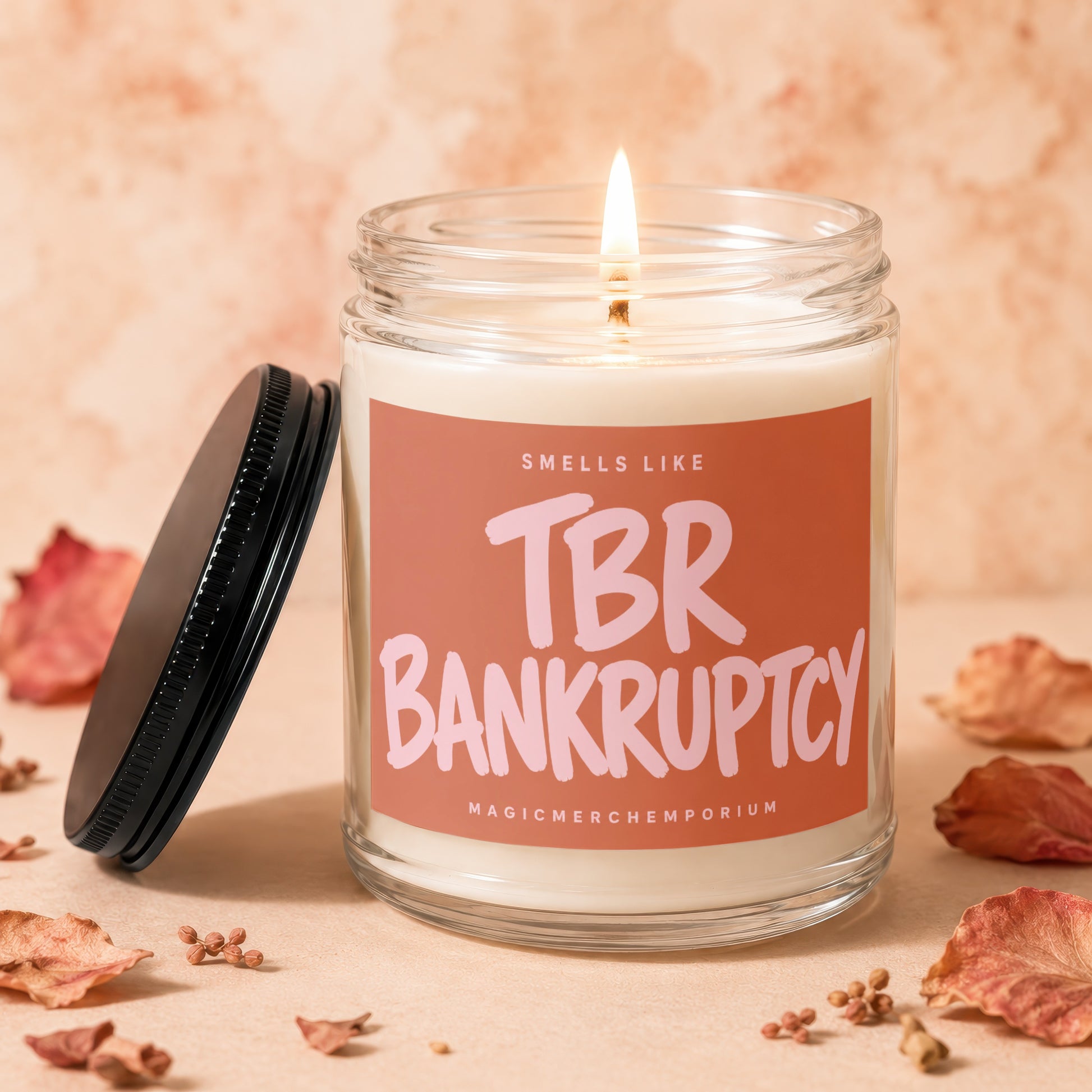 Burning candle with "TBR BANKRUPTCY" label and a black lid.