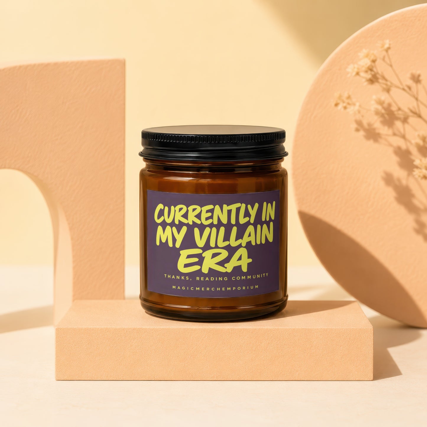 Amber jar candle with purple label reading "CURRENTLY IN MY VILLAIN ERA".