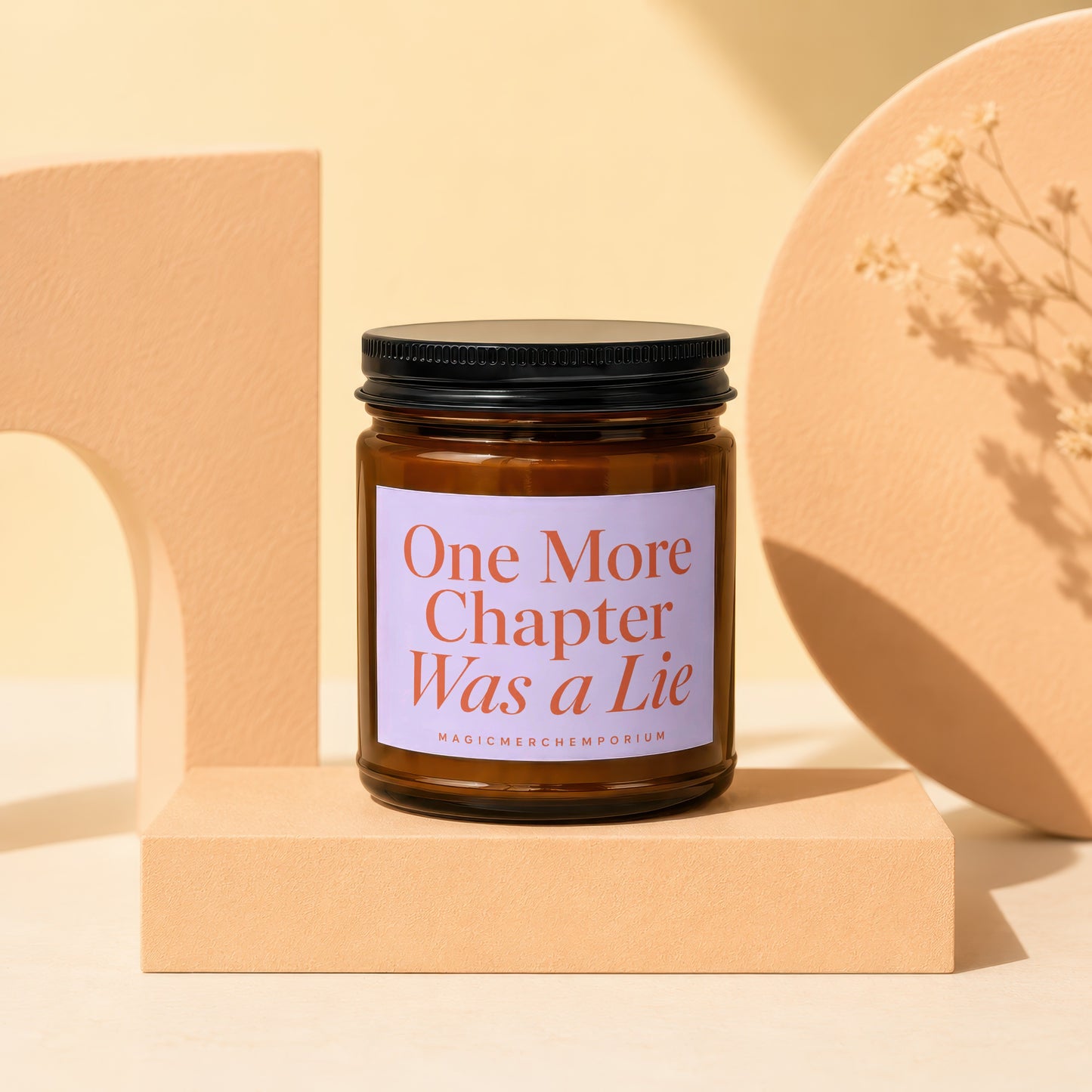 Amber jar candle with text "One More Chapter Was a Lie".