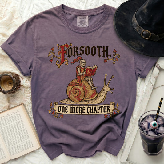 Purple t-shirt with "Forsooth, One More Chapter" and knight on snail graphic.