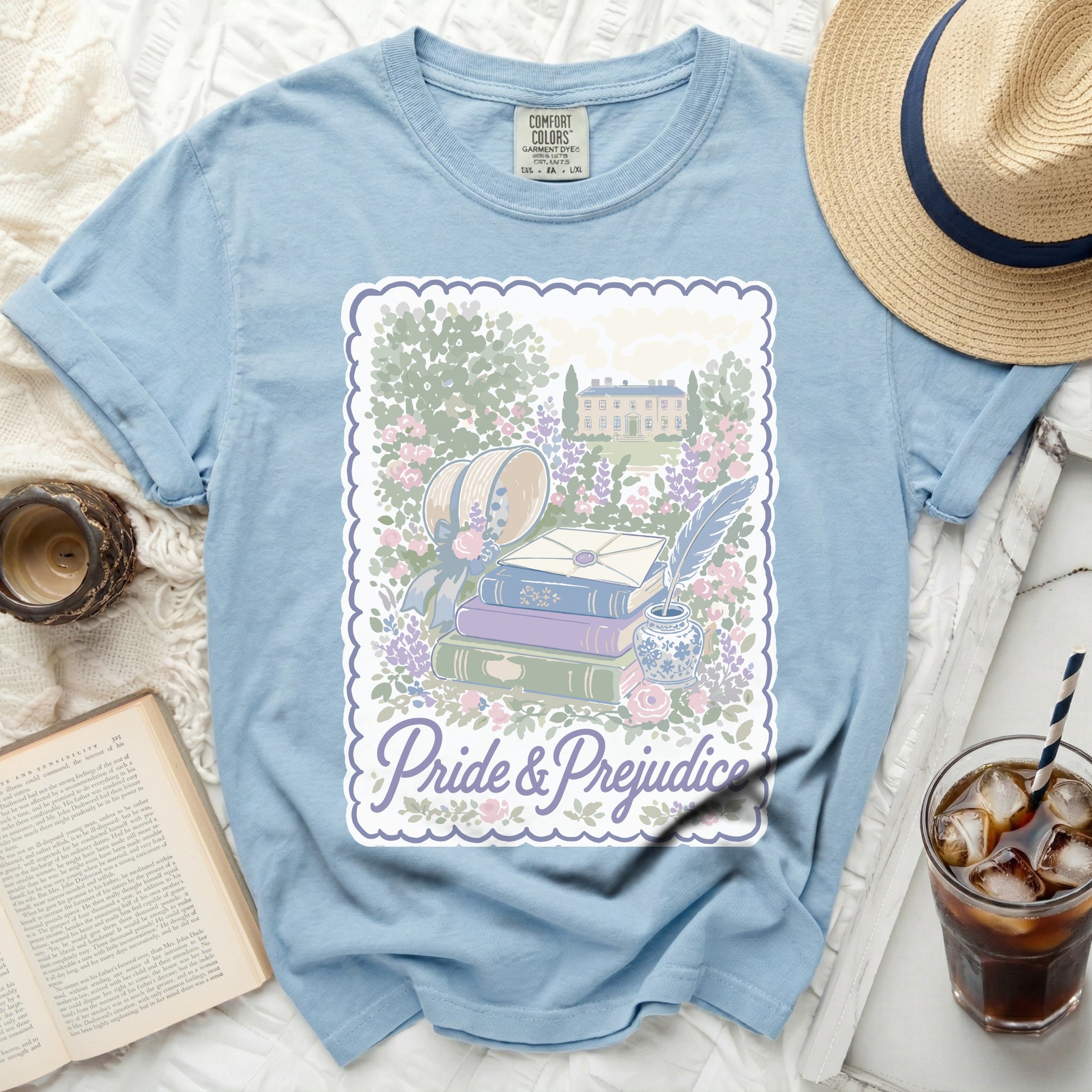 Light blue t-shirt with Pride and Prejudice book stack graphic.