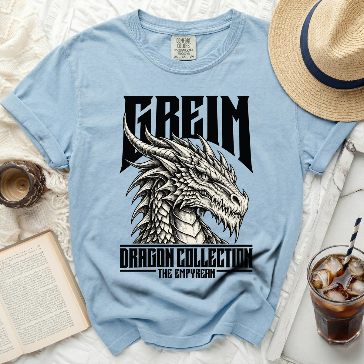 Light blue t-shirt with "FREIM DRAGON COLLECTION THE EMPYREAN" graphic.